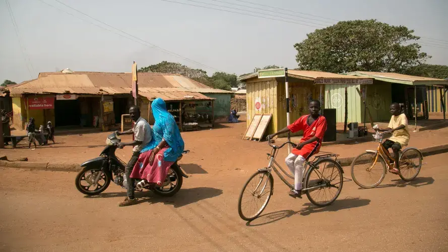 Residents of the Northern Region frequently travel by bicycle and moped. Image by Noah Fowler. Ghana, 2017.