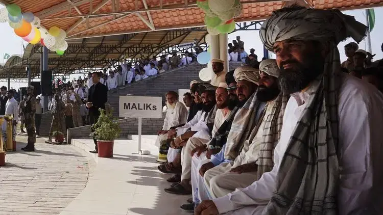 Tribesmen and soldiers at a cricket match organized by the miltary in Miramshah. Image by Umar Farooq. Pakistan, 2017.