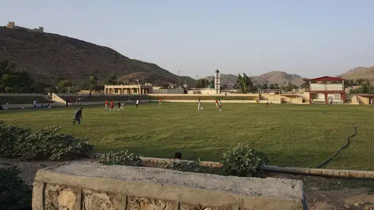 Locals play soccer in a new sports field built by the military in Miramshah. Image by Umar Farooq. Pakistan, 2017.