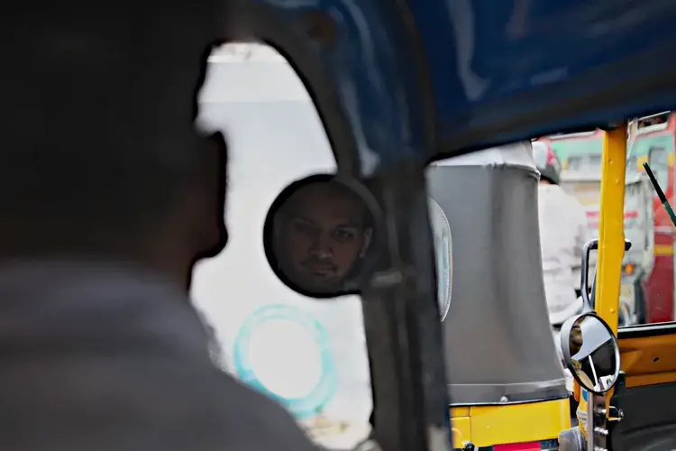 Priyank Mathur rides in a rickshaw through Mumbai. Image by Wes Bruer. 2017.