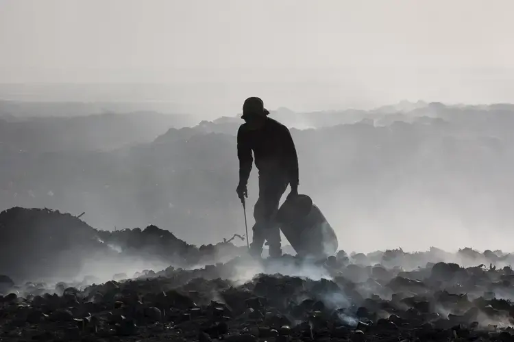 After the 2010 earthquake, NGOs dumped hundreds of thousands of gallons of raw sewage at the end of the Port-au-Prince city landfill, which borders the sea and is not lined with an impermeable material. Image by Marie Arago/NPR. Haiti, 2017.