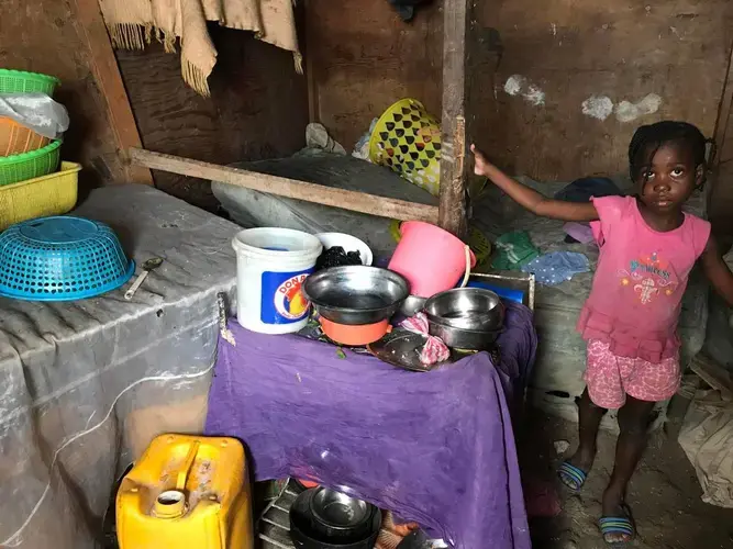 The inside of Telfort Innocent’s shack at the biggest camp in Village Caradeux in Delmas turns into a river whenever it rains. Ten years after Haiti’s 2010 earthquake, he and his children are among thousands who call the camp home. Image by Jose A. Iglesias. Haiti, 2019.