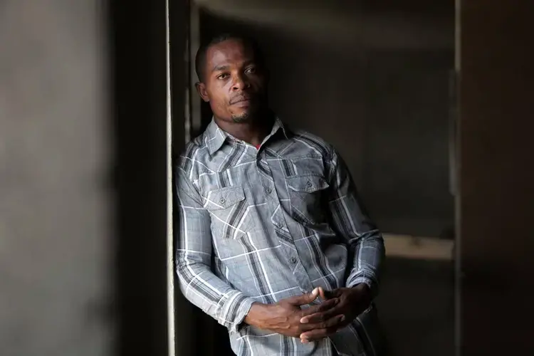 Junior Alexis, 32, is one of the leaders inside the Teren Toto camp. Alexis said the camp’s residents want to be treated as human beings and need “durable, good housing” after being displaced by the Jan. 12, 2010, earthquake. Image by Jose A. Iglesias. Haiti, 2019.