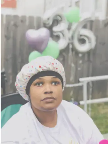 Misha helped her sister Maya celebrate her 36th birthday with a few friends and family. Misha is the primary caretaker for Maya, who has cerebral palsy. Image courtesy of the St. Louis Jewish Light.