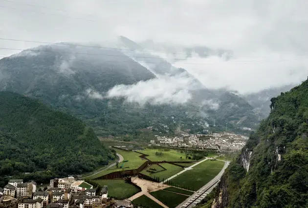 The Beichuan Earthquake Museum, near rebuilt apartment blocks and tourism facilities, just outside the ruins of Beichuan. Image by Sim Chi Yin/VII Photo. China, 2015.