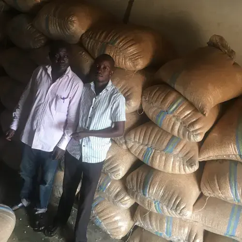 Grain merchant Kabiru Sanusi and his son Habeeb Babatunde at Elekaara Market in Ibadan, Nigeria. Image by Wome Uyeye. Nigeria, 2018.