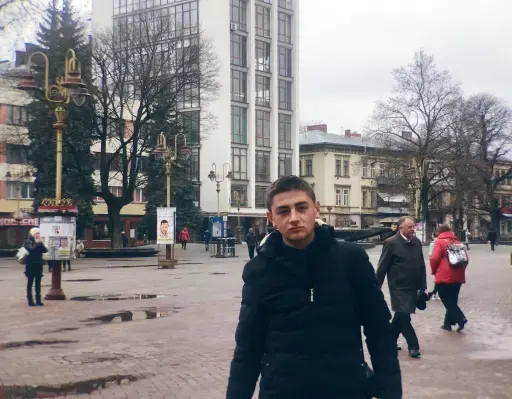 Lyubomyr Pits, 18, hands out perfume samples advertising the opening of a new store in Ivano-Frankivsk. Image by Nina Jankowicz/The World. Ukraine, 2019. 