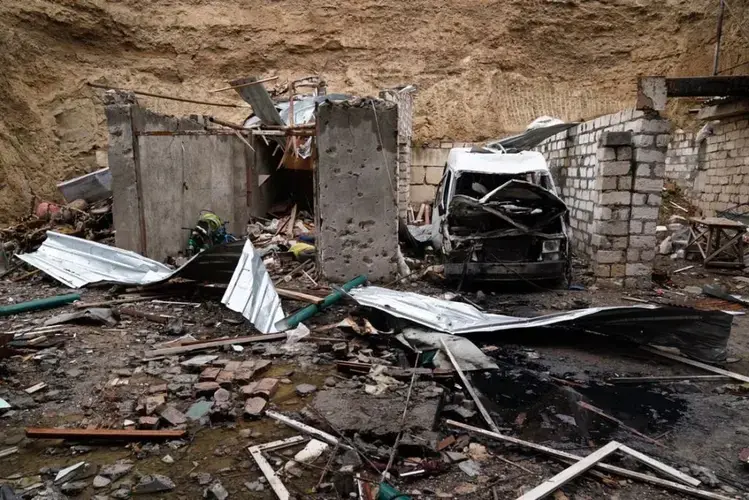 Aftermath of a rocket strike on a residential building in Stepanakert. Image by Simon Ostrovsky/Newlines. Nagorno-Karabakh, 2020.<br />
