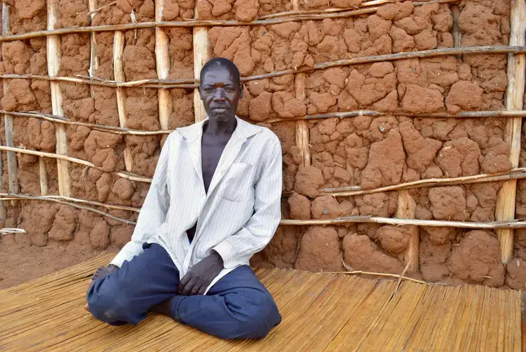 Otewu John, a 35-year resident of Walumbe, in front of his house. Image by Annika McGinnis. Uganda, 2019. </p>
<p>