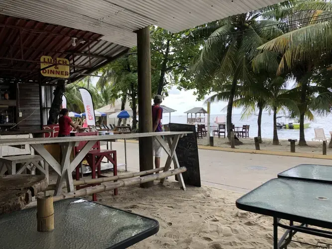 Staff at Galindo’s restaurant wait for customers. Image by Jack Shangraw. Honduras, 2019.