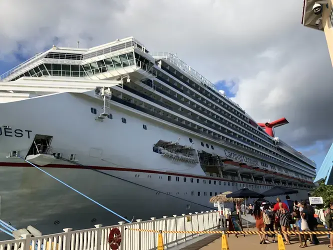 The Carnival Conquest, which carries nearly 3,000 passengers, docked at Mahogany Bay cruise port. Image by Jack Shangraw. Honduras, 2019.