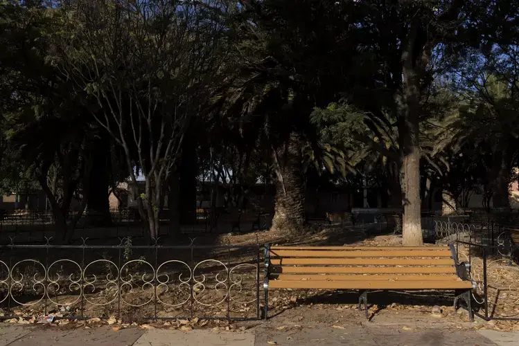 A bench in the Santa Rosa plaza bought by residents of Santa Rosa living in Virginia. Image by Carey Averbook. Bolivia, 2016.