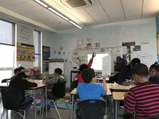 In the fourth grade math Class. Students started to raise their hands. The three boy in the left table were all ELs. Image by Thea Gu. United States, 2017.