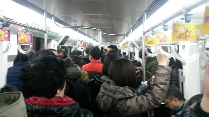 Beijing’s crowded, fast-growing subway system is a symbol of the breakneck economic growth that, in addition to lifting hundreds of millions of people from poverty, has also left China with polluted air, tainted water, and poisoned soil. Image by Beth Gardiner. China, 2017.