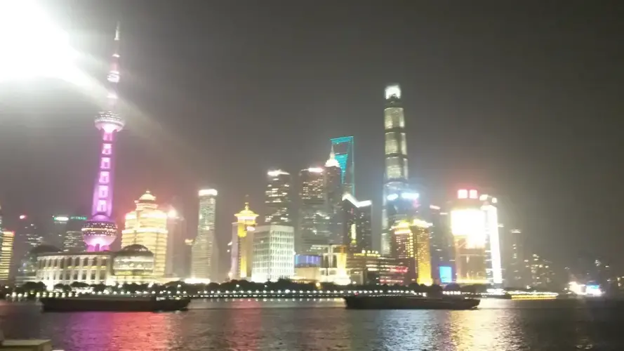 Pollution hangs heavy over Shanghai’s skyline, dulling its bright lights. Image by Beth Gardiner. China, 2017.