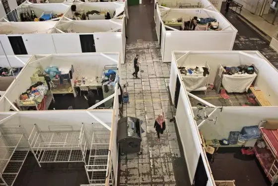 Berlin’s Tempelhof refugee shelter, on the site of a former airport south of the city center, is Germany’s largest, with room to accommodate as many as 2,400 people. Image by Lynsey Addario. Germany, 2017.