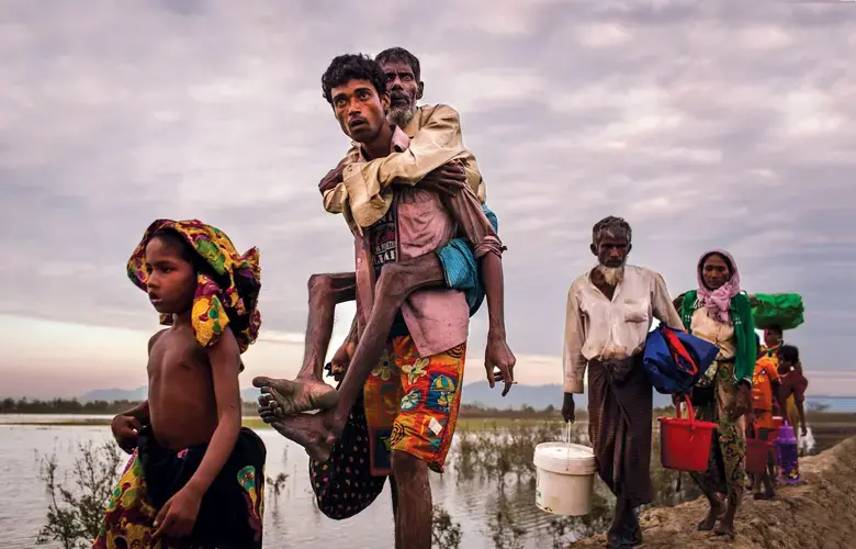 A family of Rohingya Muslims flee Myanmar after a wave of violence last fall. Photo: Patrick Brown/Panos Pictures/UNICEF