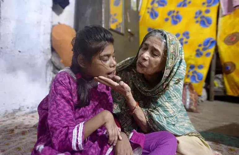 Zoya, 15, with her grandmother Asha Bi. Image by Rohit Jain. India, 2020.