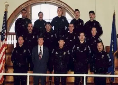 In the front row, on the left, Sgt. Hart Daley and Lt. Wayne Gallant are pictured in this December 1999 Rumford Police Department photo. Daley and Gallant knew each other professionally for a couple of decades. Daley joined the Oxford County Sheriff’s Office as a captain in 2006, the same year Gallant was elected sheriff. Image courtesy of the Rumford Police Department.<br />
