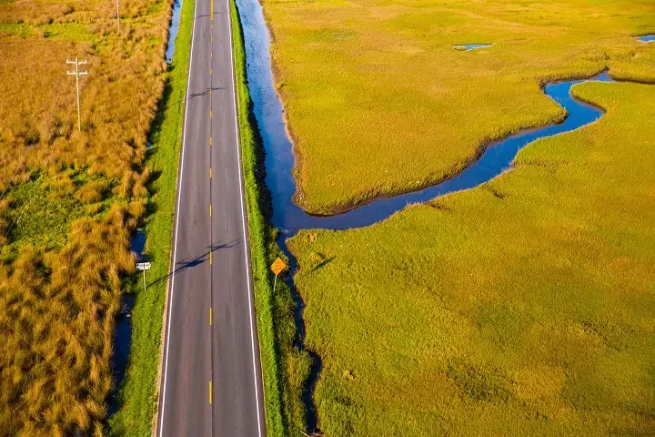 ROAD WORK AHEAD, 2016. North River bridge approach, the gateway to Down East. This photo is part of the “RISING” exhibit. Image by Baxter Miller. United States, 2016.