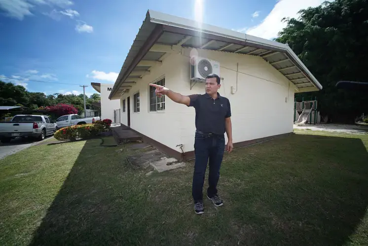 Roy Quintanilla stands outside the building that once served as then-Fr. Apuron's living quarters. Quintanilla, in a lawsuit, claims Apuron sexually assaulted him. Image by Cory Lum. Guam, 2017.