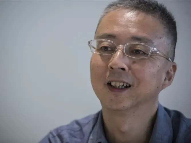 Wang Yong, opinion editor of the Shanghai Daily, gives an interview on Sunday, Oct. 1, 2017 in the Daily newsroom in Shanghai, China. Image by Kelsey Kremer. China, 2017.