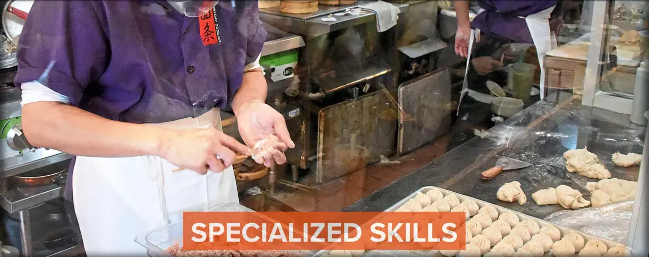 Chung Yu forms the dough for pork soup dumplings at Everyday Noodles. Image by Darrell Sapp. United States, 2018.