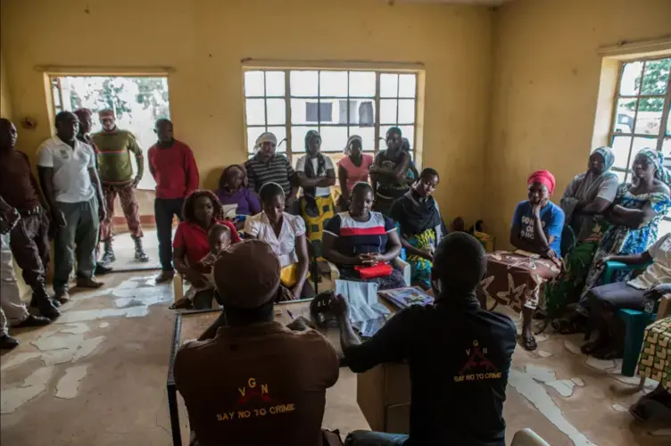 Settling these smaller disputes, in addition to the larger ones, helps the volunteers build trust in the community. Image by Jane Hahn. Nigeria, 2018.