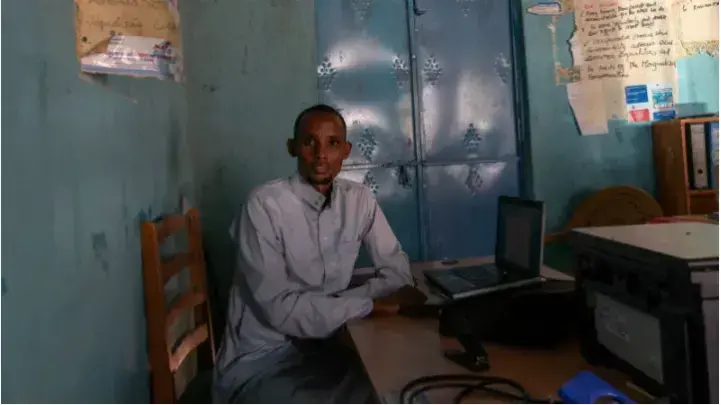 A portrait of Mohamed Omar, executive director of Wajir Paralegal Network in his office in Wajir, Kenya. Image by Peter DiCampo. 2018.