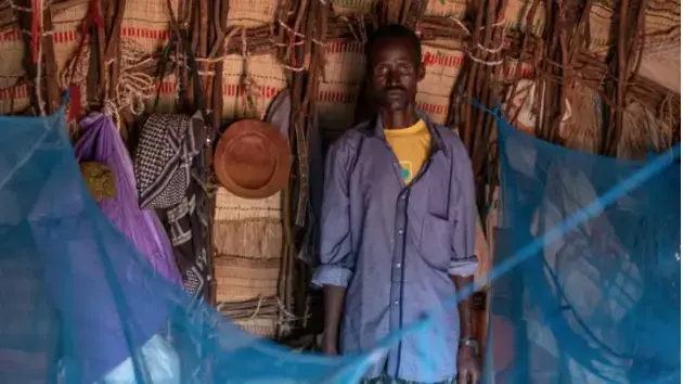 Hassan Mohamed, 40, a resident of  Boji-Heri, Wajir County, Kenya. Mohamed lives a few meters from the  Boji-Heri dispensary, but his wife died during childbirth because there was no nurse or medical officer at the facility when she went into labor. Image by Peter DiCampo. 2018. 