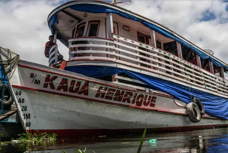 An Amazon river boat. Such vessels have long been a chief means of travel for locals and for tourists. But new roads and railways are steadily being built across the Brazilian Amazon, bringing large scale settlement, agribusiness and mining. Image by Matheus Manfredini. Brazil, 2019.
