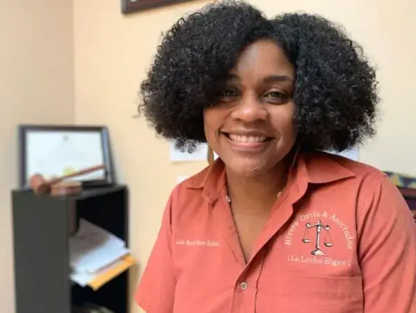 Maraliz Rivera Gutiérrez, Esq., is one of the lawyers at her father’s firm. Her shirt reads “¡La luche sigue!” or “The continues!” Image by Natasha S. Alford. United States, 2019.