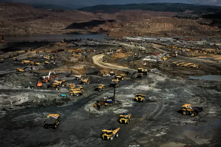 Company trucks dot a massive government-licensed jade mining site in Hpakant on Oct. 16, 2018. Image by Hkun Lat. Myanmar, 2018.