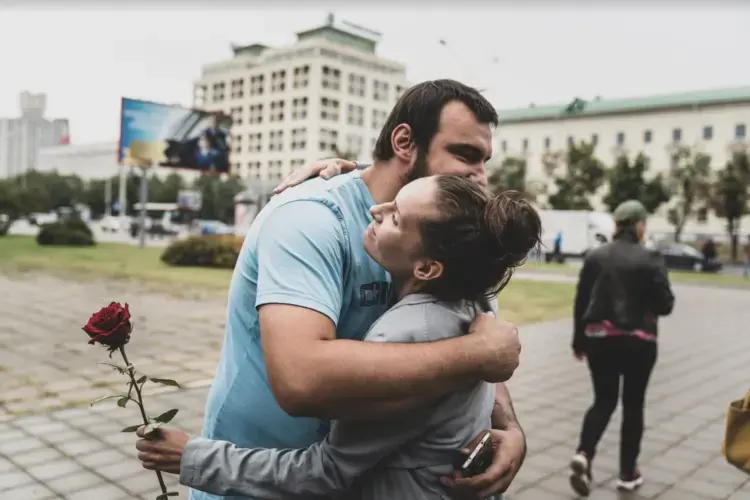 Dylevsky embraces a protester: 'the people want something new,' he said. Image by Evgeniy Maloletka. Belarus, 2020.