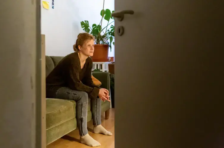 Anika Färber, a youth trainer with the Network for Democracy and Courage in Germany, at her home in Erfurt, Germany. Image by Ryan Delaney/St. Louis Public Radio.