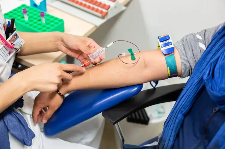 Wael receives blood tests ahead of his first session of testosterone therapy at a hospital in Oslo. He travels from Bergen for the therapy, as Oslo is home to one of the only hospitals in the country that is equipped to deal with transgender issues. Image by Bradley Secker. Norway, 2020.