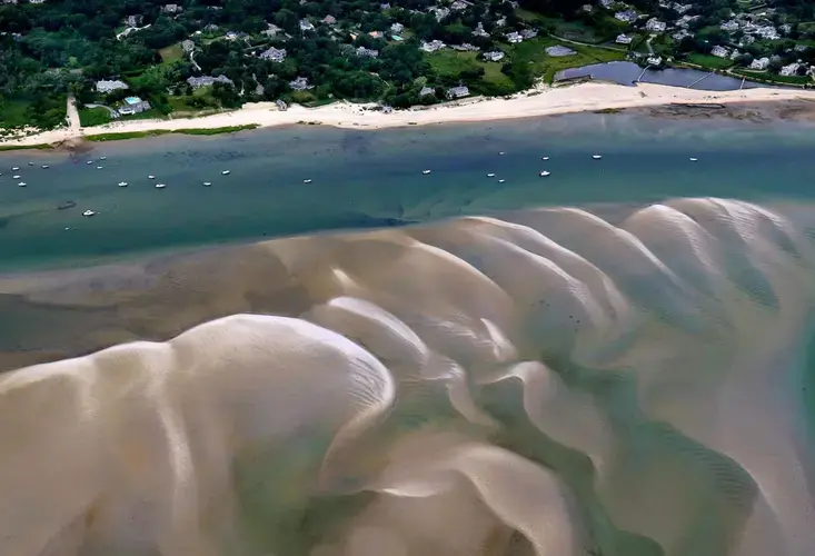 Sandbars formed a pattern in Chatham Harbor. Image by John Tlumacki. United States, 2019.