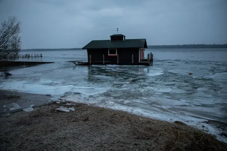 A floating boathouse during a storm in Snows Channel at Les Cheneaux Islands in the Upper Peninsula of Michigan on Nov. 21, 2019. Image by Zbigniew Bzdak / Chicago Tribune. United States, 2020.