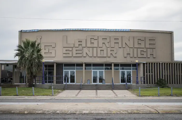 LaGrange High School remains damaged months after back-to-back Hurricanes Laura and Delta passed through the state. Many students and teachers are still displaced, living with relatives or in hotels paid for by the state. Image by Katie Sikora. United States, 2020.<br />