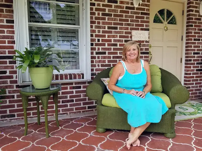 Roberta Spencer, 64, sits outside her Key Haven home in what would have been the control area of Oxitec's trial of genetically modified mosquitoes. She opposed the trial because she 'didn't feel the science was proven enough.' Image by Devi Shastri. United States, 2017.