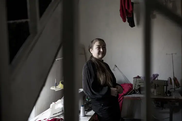 Dina Nurdybai in her sewing workshop at her home in Almaty, Kazakhstan, on February 25, 2020. Image by Ekaterina Anchevskaya / BuzzFeed News. Kazakhstan, 2020.