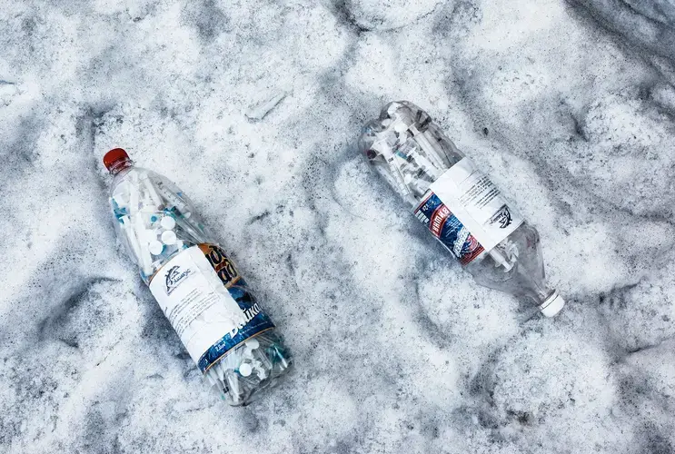 Plastic bottles full of used syringes and needles collected by outreach workers from drug users in 2011 in exchange for clean needles and wet wipes. Image by Misha Friedman. Ukraine, 2011.