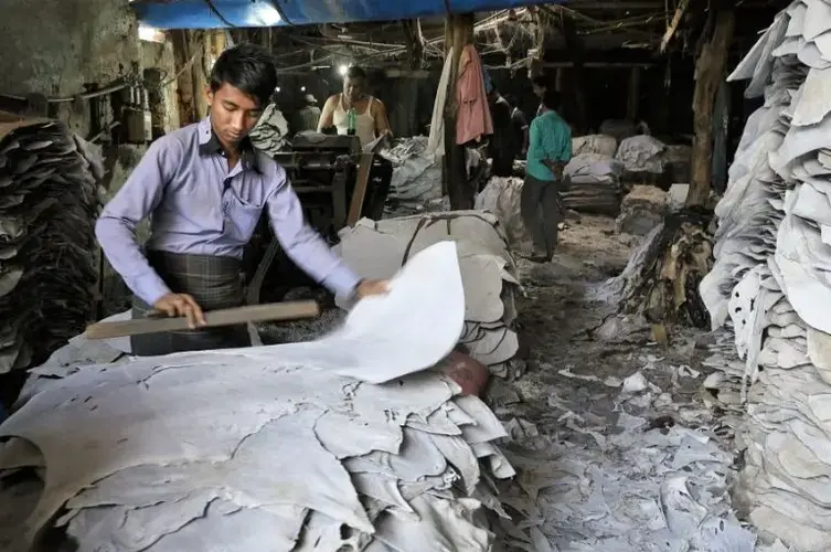 Workers process hides at a tannery in Dhaka’s Hazaribagh district. Leather in Bangladesh has grown to a $1 billion per year industry. Image by Justin Kenny. Bangladesh, 2016.<br />
