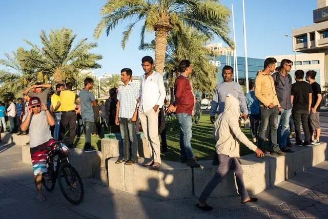 Workers sometimes spend time in the city on rare time off. Image by OM. Qatar, 2017.