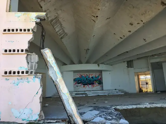 A damaged community center the approved rock wall was supposed to protect. Image courtesy of Kari Lydersen, Isabel Dieppa, and Martha Bayne. Puerto Rico, 2019.