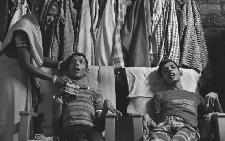 Living victims: Vikas Yadav, 19, and Aman Yadav, 17, brothers, have muscular dystrophy and are being cared for by their mother at their home. Affected by toxic waste which seeped into the groundwater, they will live short, painful lives. Image by Rohit Jain. India, 2018.