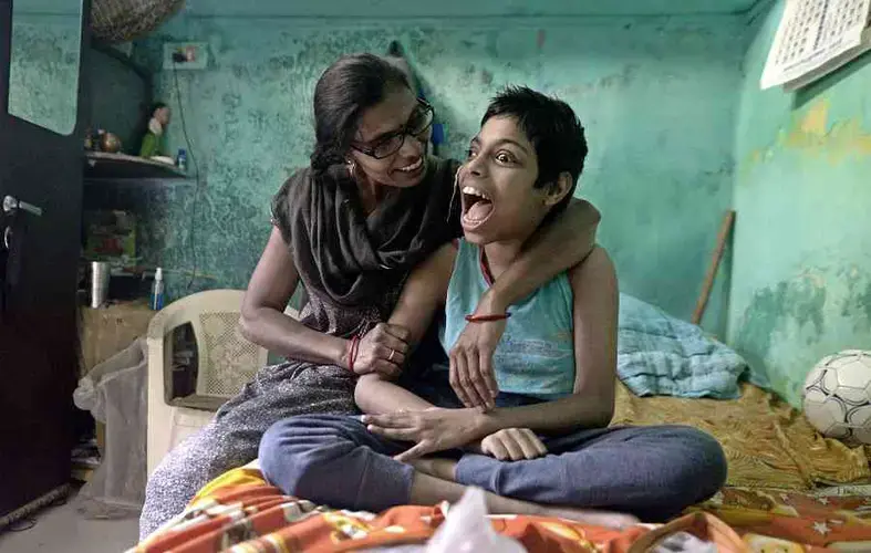 Manisha, 13, with her mother Manju. Image by Rohit Jain. India, 2020.