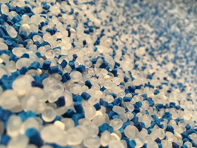 Virgin plastic pellets and blue plastic pigment pellets. Image by Joyce Blessthink / Shutterstock. Undated.
