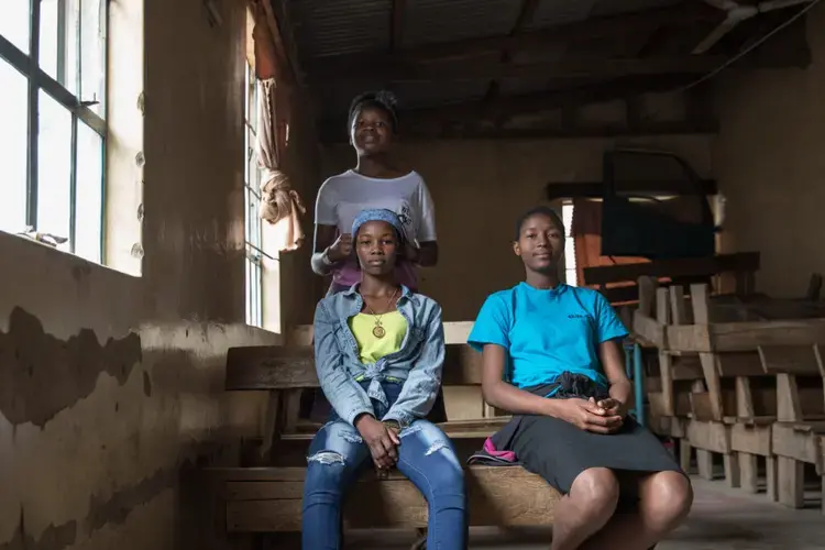 Adelaide, 14, Christine, 17, and Jackline, 13, wait for the Girls on the Move group meeting to start. Image by Sarah Waiswa/The Everyday Projects. Kenya, 2020.</p>
<p>