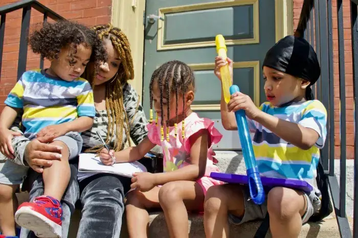 Home schooling her children has given Courtnesha a new appreciation for teachers. Image by Wiley Price / St. Louis American. United States, 2020.